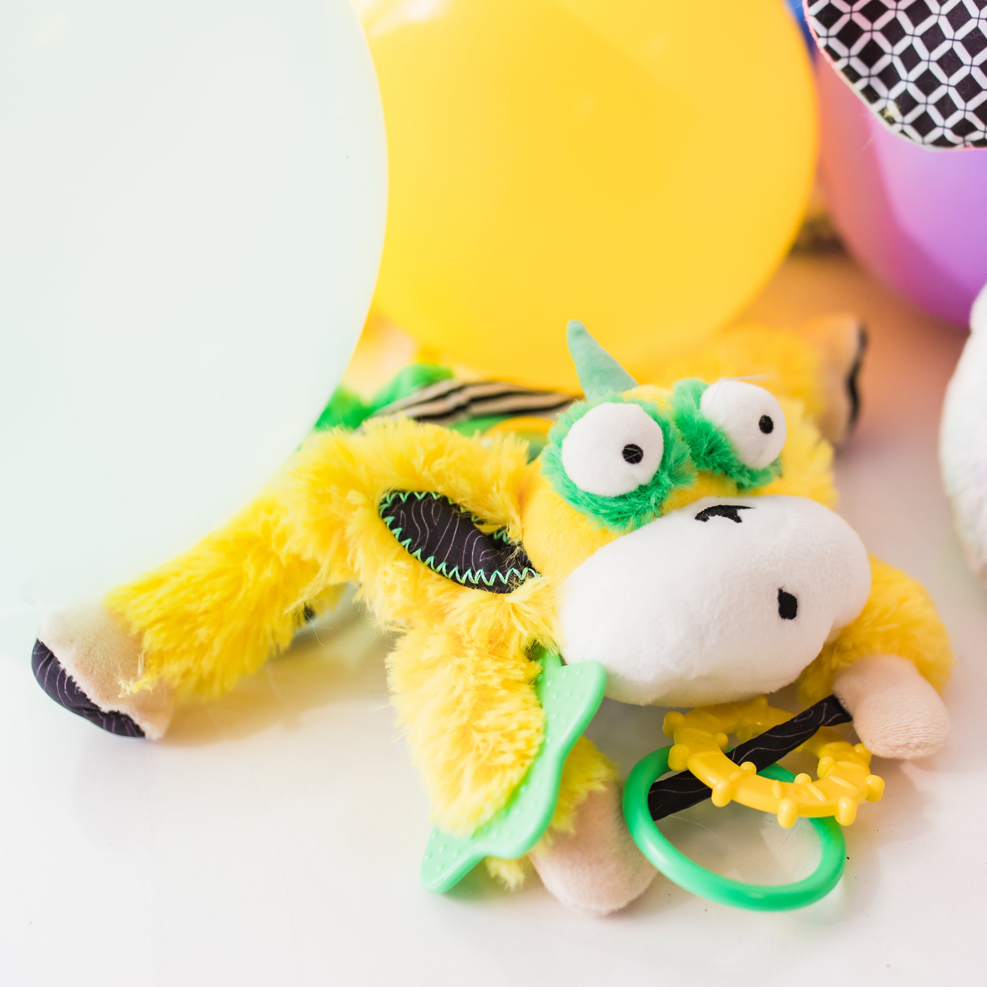 Marley the Monkey Spin Belly hanging activity toy – spinning rattling beads stroller clip sensory toy ages 0-12 months yellow balloons